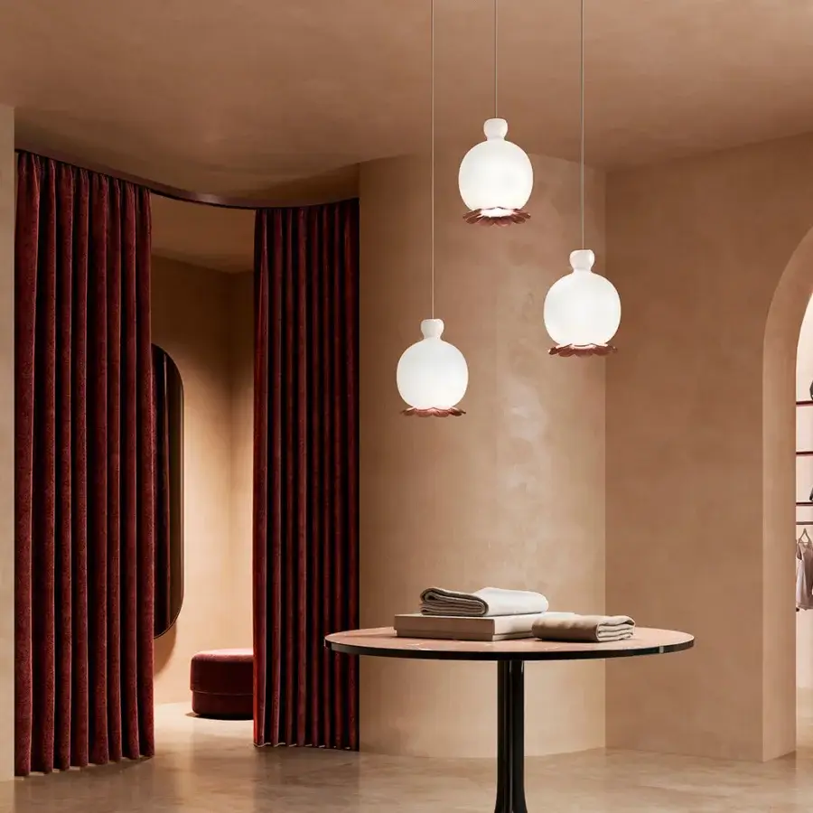 Distinguished Kundalini Opyo suspension lamp with a spherical opal diffuser and reddish-brown metallic finish